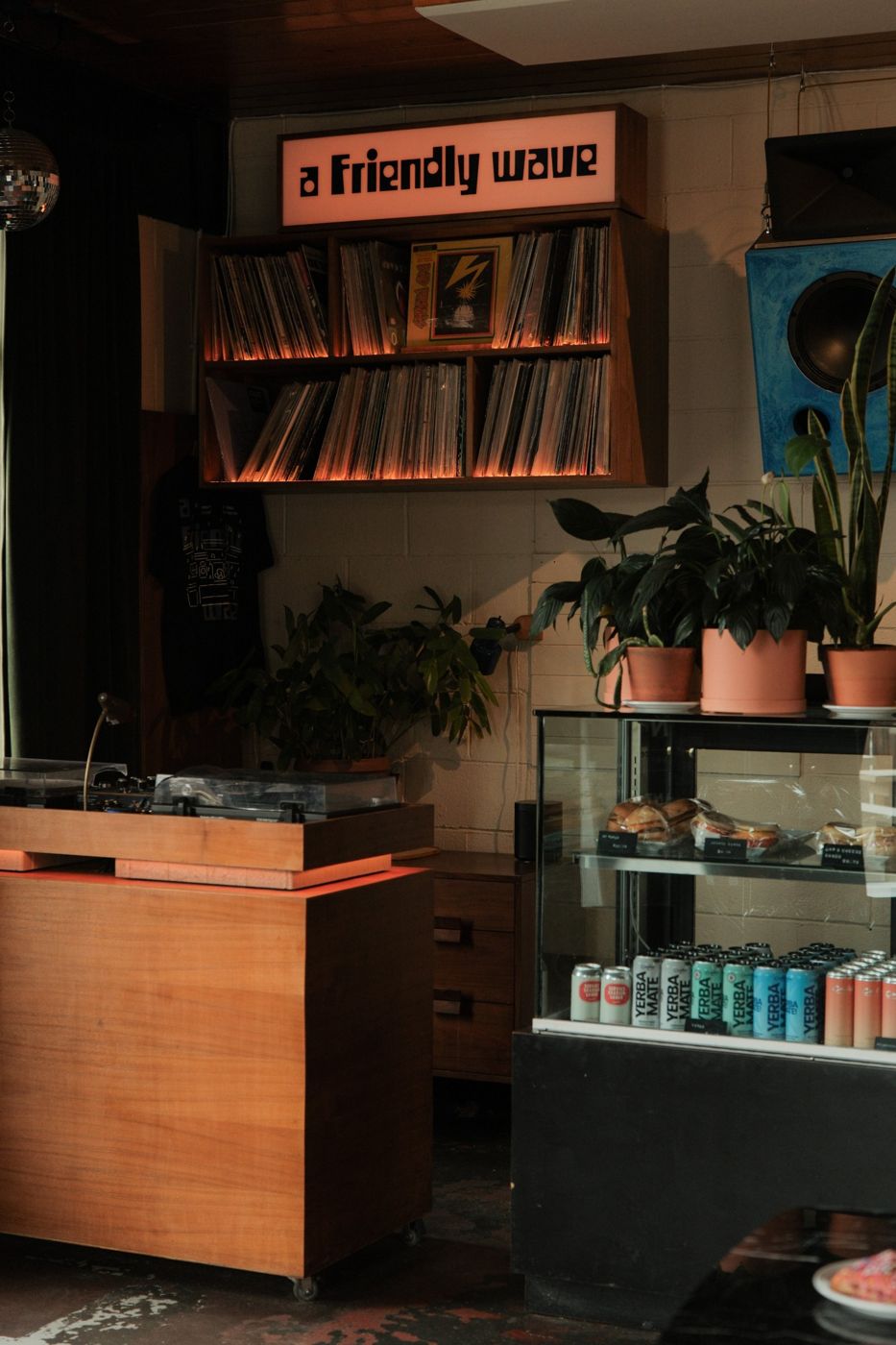 The cafe corner with records, turntables and the pastry case